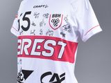 a close up of a white shirt with red and black writing on it