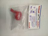 a red object in a plastic bag on a table