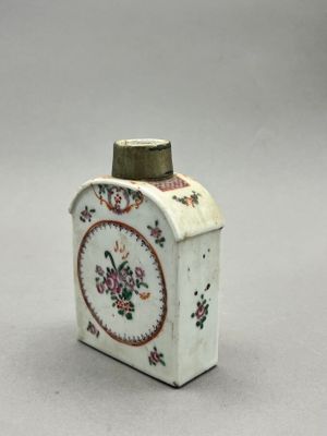 a small white box with a floral design on it