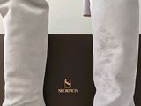 someone is wearing a pair of white boots and a white shirt