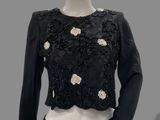 an image of a mannequin wearing a black top and skirt