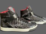 pair of black and red high top sneakers with red soles