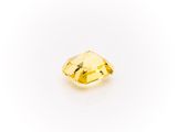 a yellow diamond on a white background