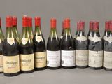 several bottles of wine are lined up on a table