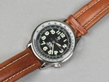 an image of a close up of a wrist watch on a table