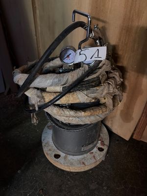 a hose that is sitting on top of a pile of wood