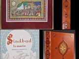 plusieurs livres avec des photos de personnes dessus et une photo d'un bateau