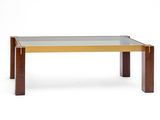 a coffee table with a glass top and wooden legs