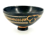 a black and gold bowl on a white background