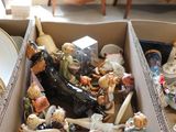 a box full of figurines sitting on the floor