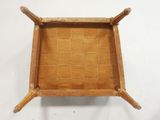 an image of a small wooden tray on a white surface