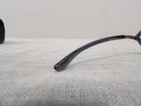 a pair of glasses that are laying on a bed