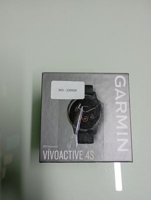 a box with a watch inside of it on a glass table