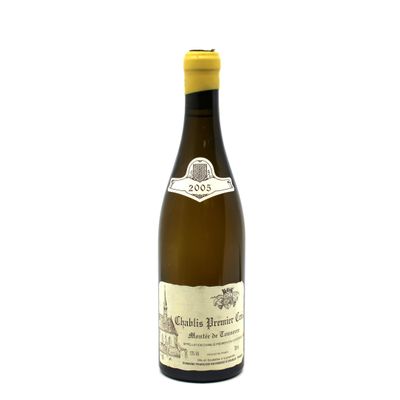 the bottle of white wine is sitting on a white surface