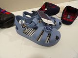 a pair of sandals and a pair of shoes on a table