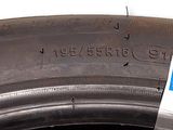 a close up of a tire with a sticker on it