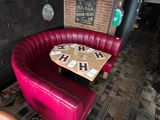 tables and chairs in a restaurant with a heart shaped table in the middle