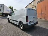 a white van that is parked on the side of the road