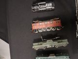 a lot of toy trains that are on the table