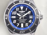 a close up of a wrist watch with a blue face