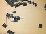 many pieces of electronic equipment on the floor of a room