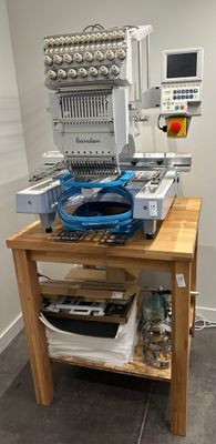 a machine that is sitting on top of a wooden table