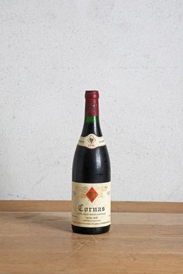 a bottle of wine that is sitting on a table