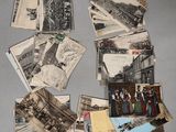 many old photos of people and buildings on the table