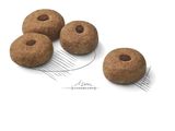 four doughnuts sitting on top of a white surface next to a wire