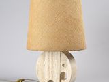 an image of a wooden lamp with a burlock shade on top of it