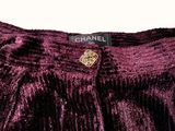 a close up of a purple dress with a label on it