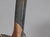 a close up of a vase with a handle on it