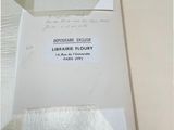an open box with a piece of paper inside of it