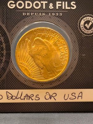 a picture of a gold coin with a picture of a man on it