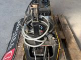 a picture of a forklift with a hose attached to it