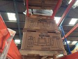 boxes stacked on top of each other on a pallet in a warehouse