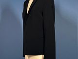 this image may contain a mannequin and a suit on a mannequin stand