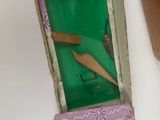 a small box with a picture of a woman inside of it