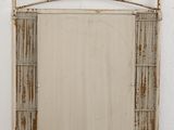 an image of a mirror hanging on a wall next to a white wall