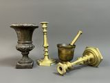 several different types of brass objects are displayed on a gray surface