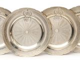 six silver plated plates on a white background with a white background
