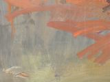 a painting with orange paint on it that is on the wall