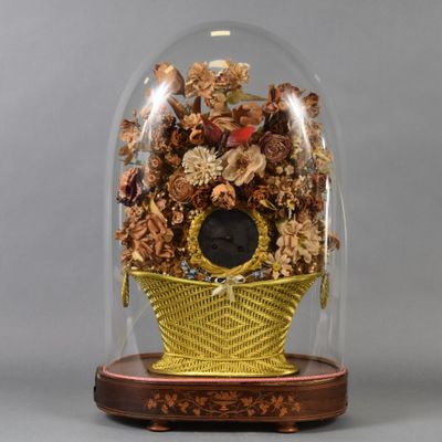 a glass dome with a clock inside of it