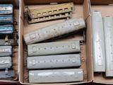 a box full of assorted toy trains in it