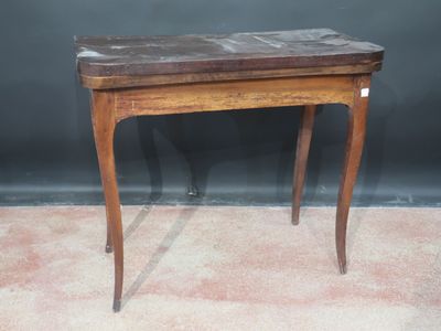 a small wooden table with a marble top on it