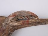 a bird that is sitting on a piece of wood