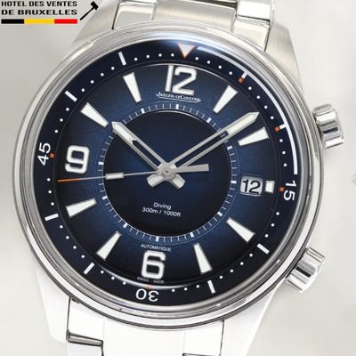 a close up of a watch on a white surface
