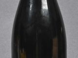 a bottle of wine that is sitting on a table