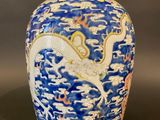 an image of a blue and white vase with a bird on it