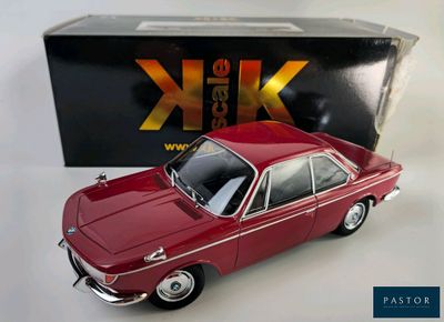 a toy car that is sitting in front of a box